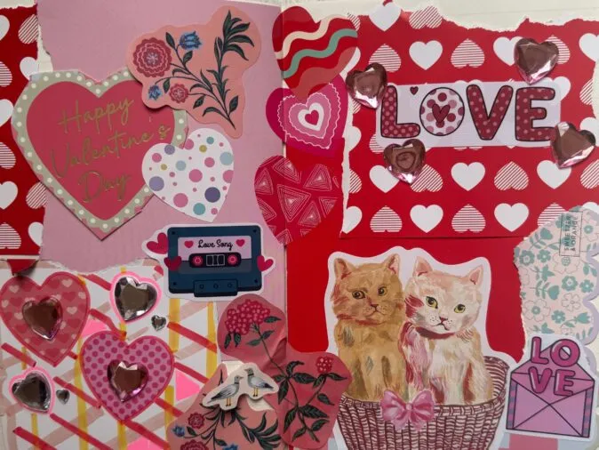 Handmade Valentine’s collage on pink and red paper with layered hearts, floral cutouts, and shiny heart stickers; text reads “Happy Valentine’s Day” and “LOVE,” and includes a cassette labeled “Love Song,” two cats in a basket, and a small “LOVE” envelope graphic.