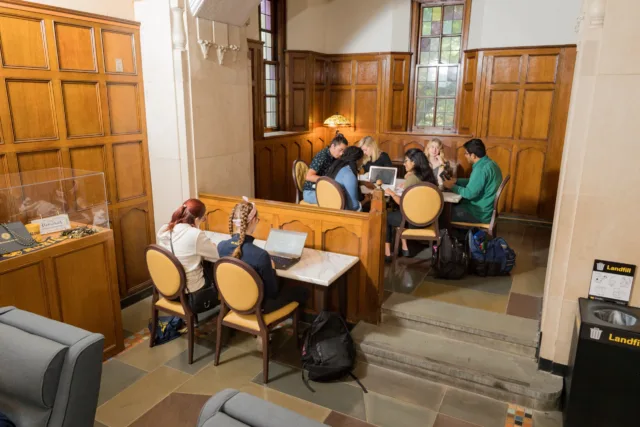 A group of student study in the lobby of the Michigan League.