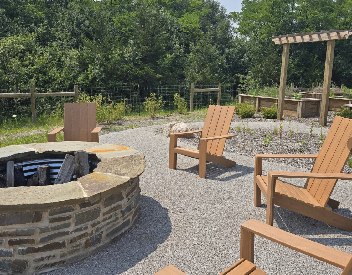 Chairs set up around a bonfire outside