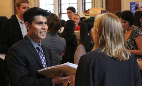 Students mingle with recruiters at a UCC career fair.