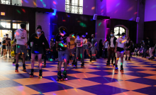 Students roller-skate indoors